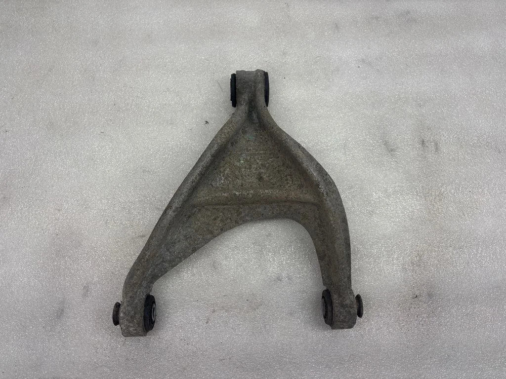 Rear upper control arm/wishbone – left