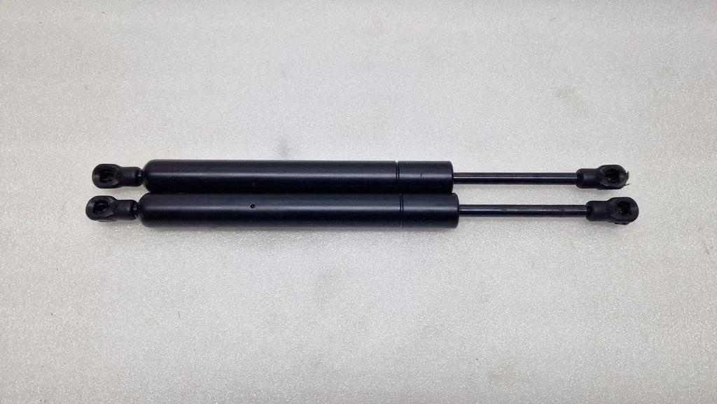 Aizmugurējā vāka amortizators – Saab 9-3 Ver2 (2003-2007)