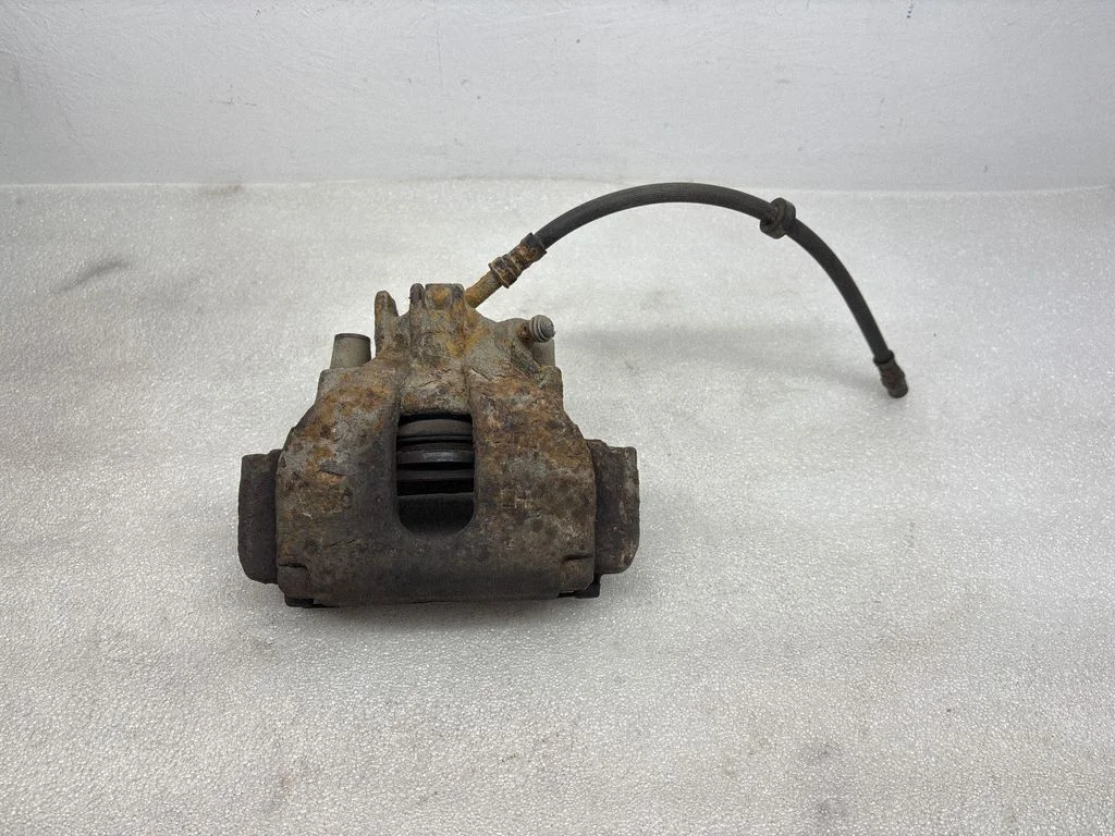 Front brake caliper – left