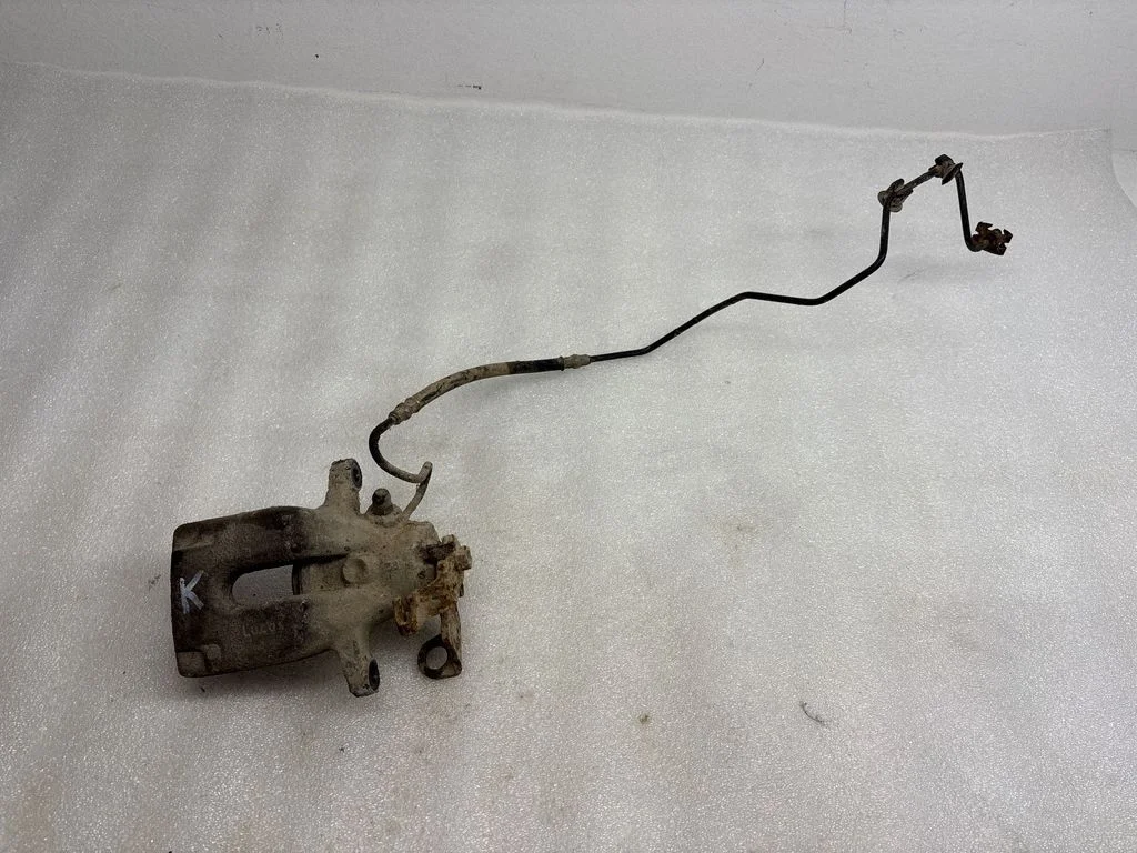 Rear brake caliper – left
