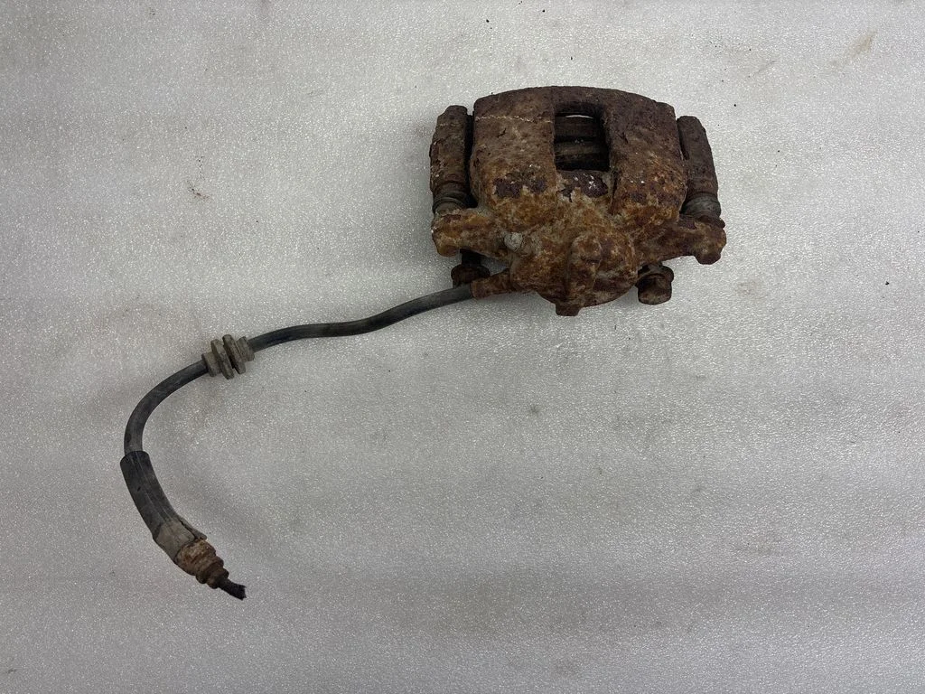 Rear brake caliper – left