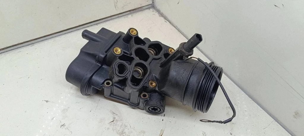 Oil filter mounting bracket 06D115397D