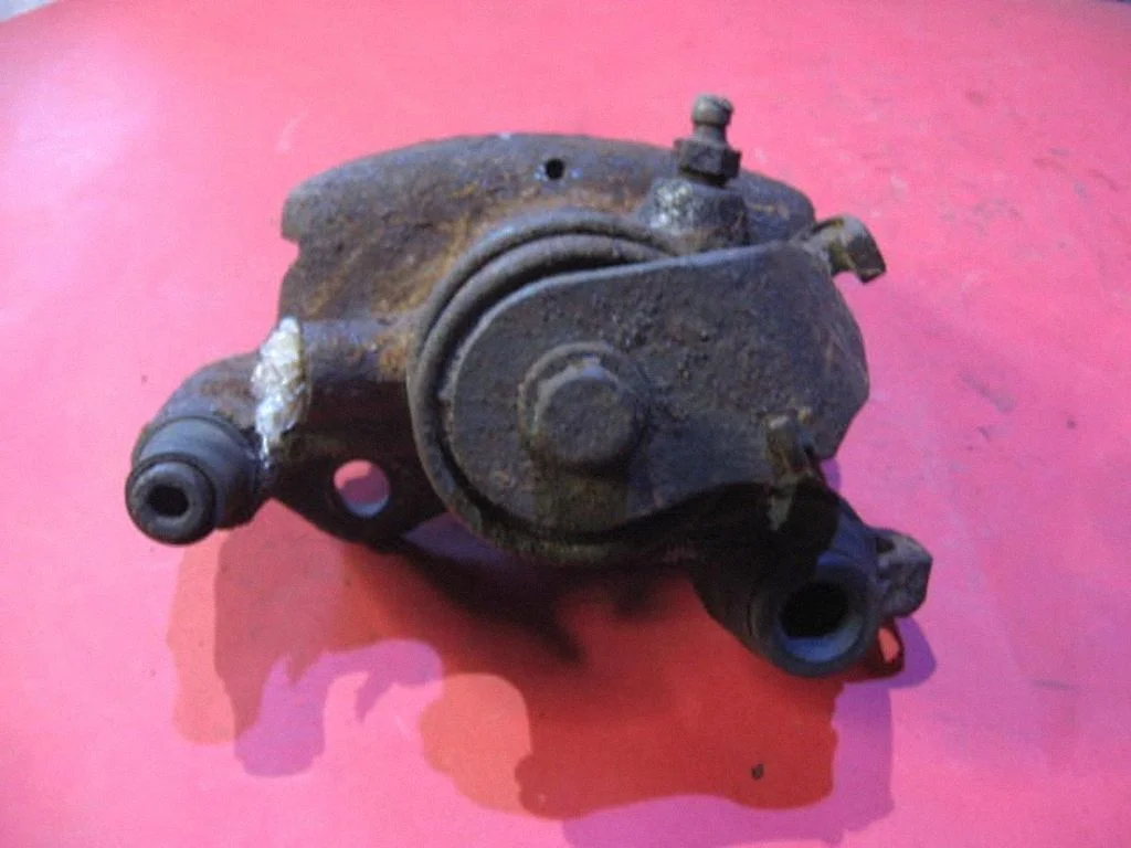 Rear brake caliper 77004893