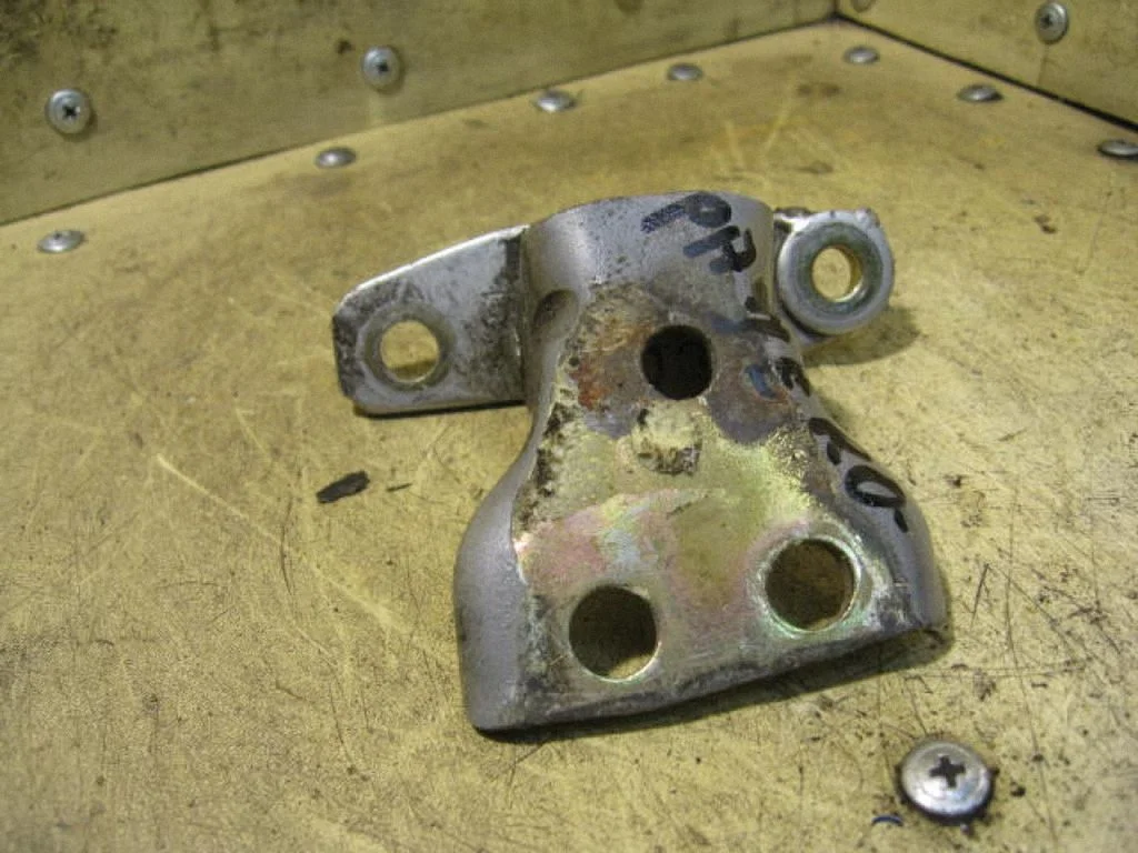Rear door upper hinge
