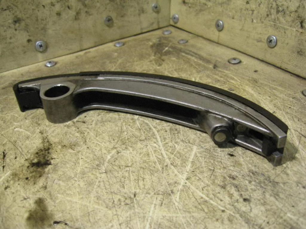 Timing belt/chain tensioner 90502311