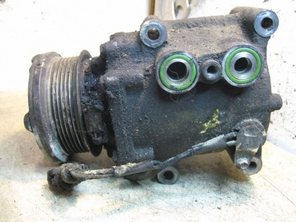 Air conditioning (A/C) compressor (pump) – left
