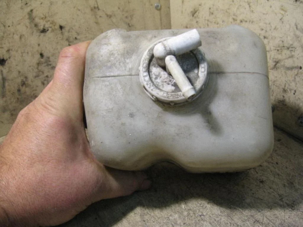 Coolant expansion tank/reservoir – left