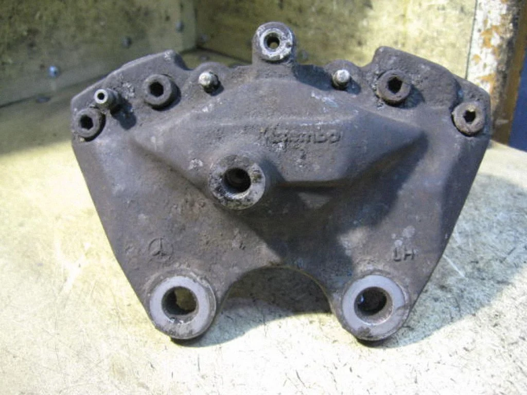 Rear brake caliper – left