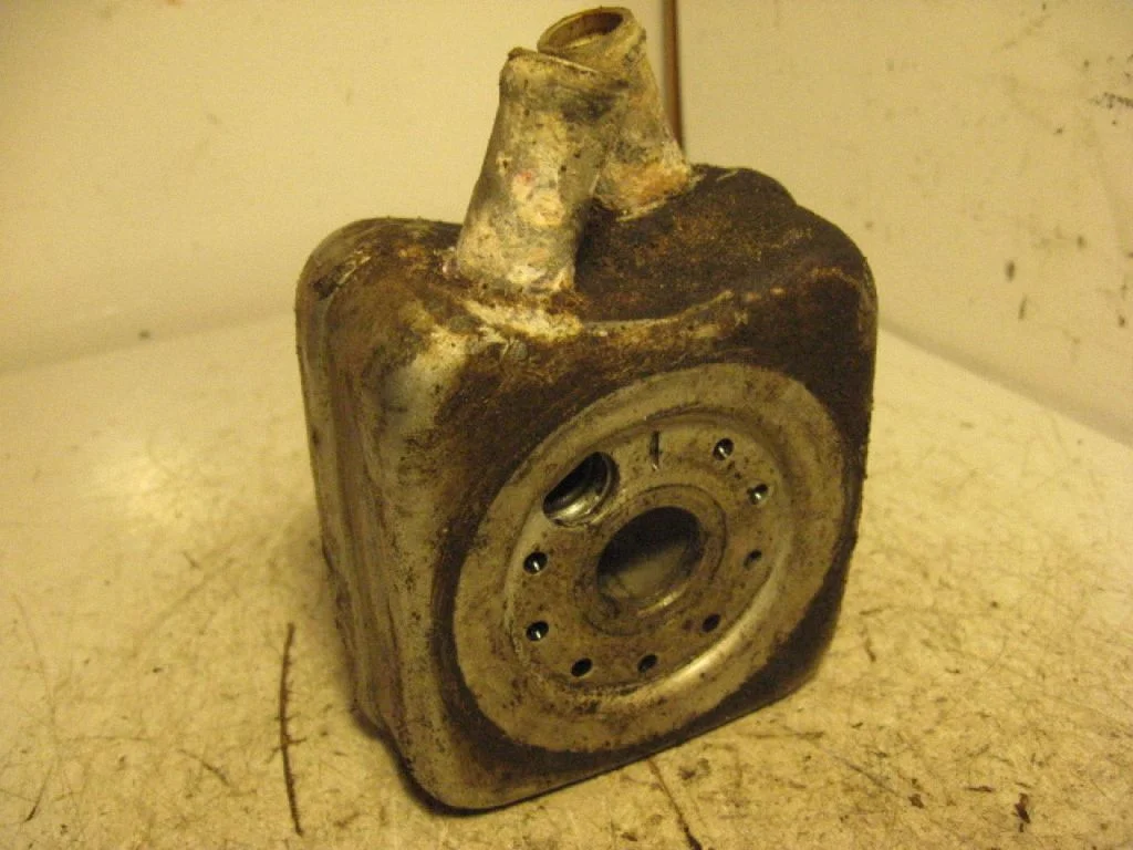 Oil filter mounting bracket – left
