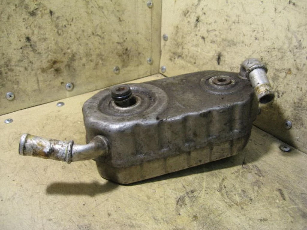 Oil filter mounting bracket – left