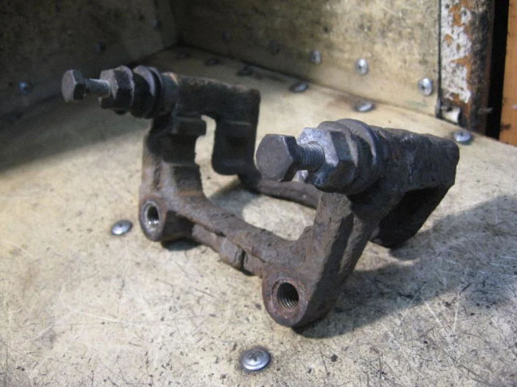 Brake caliper pad carrier rear
