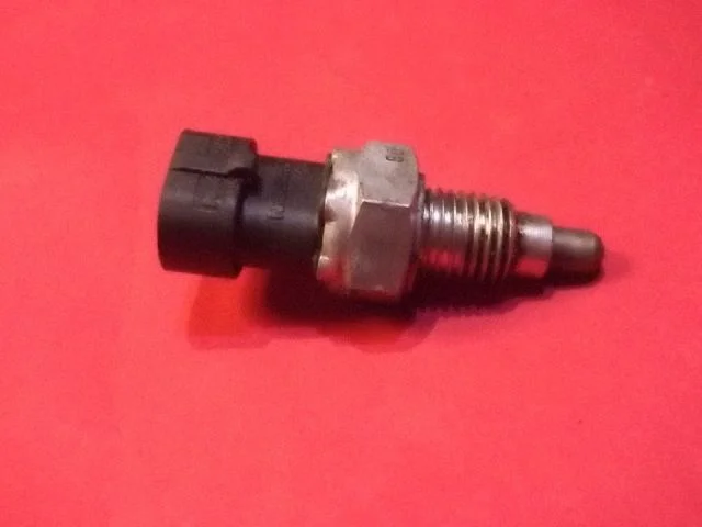 Reversing light switch sensor