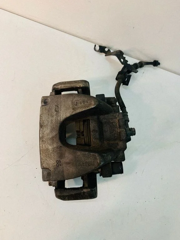 Front brake caliper A426M