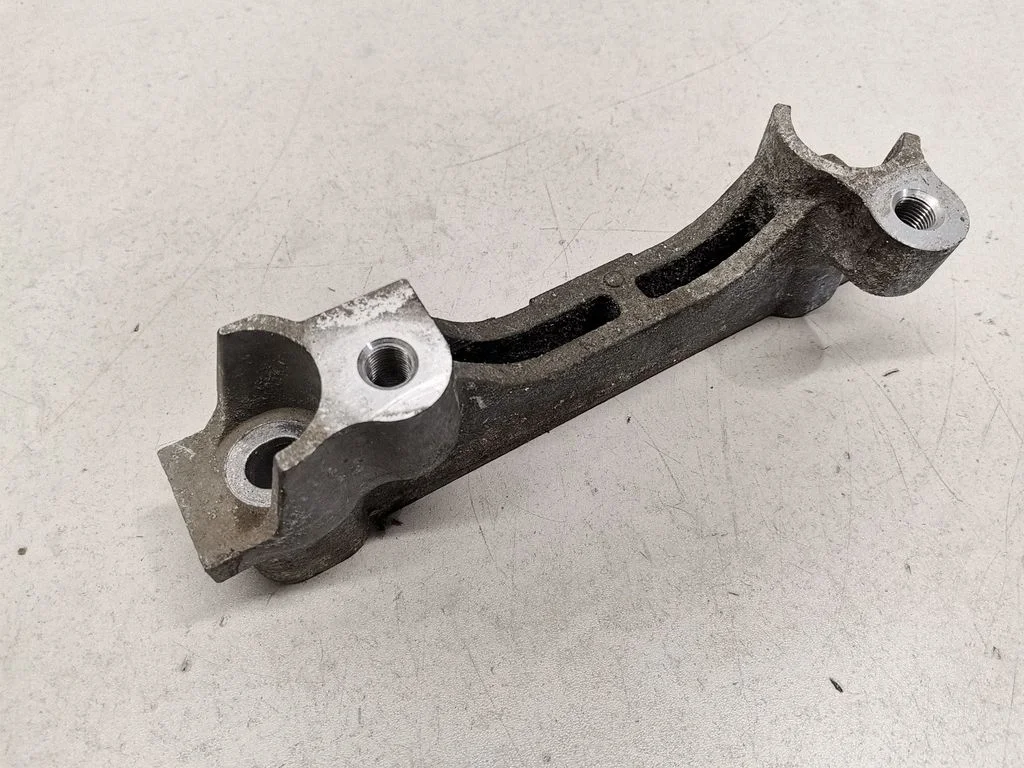 Engine mount bracket – front