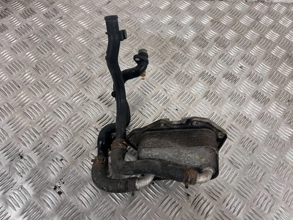 Oil filter mounting bracket 06E117021G