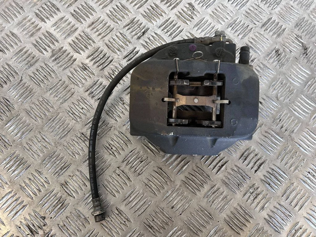 Rear brake caliper – left