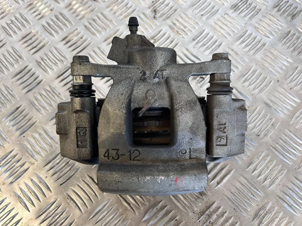 Rear brake caliper – left