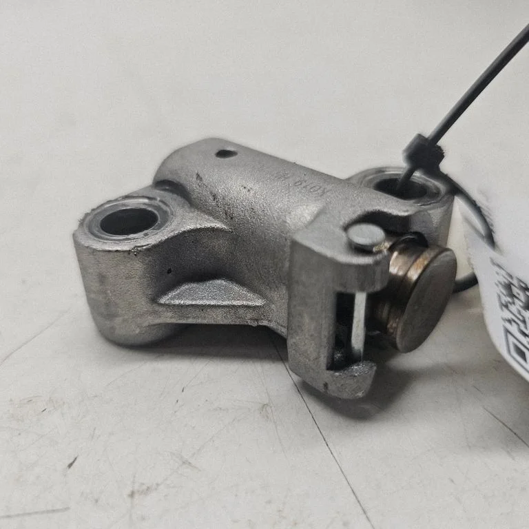 Timing belt/chain tensioner