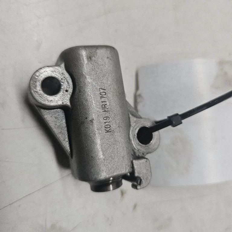 Timing belt/chain tensioner