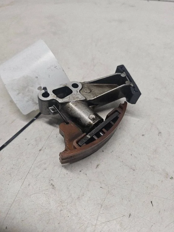 Timing belt/chain tensioner
