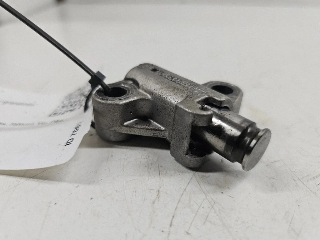 Timing belt/chain tensioner