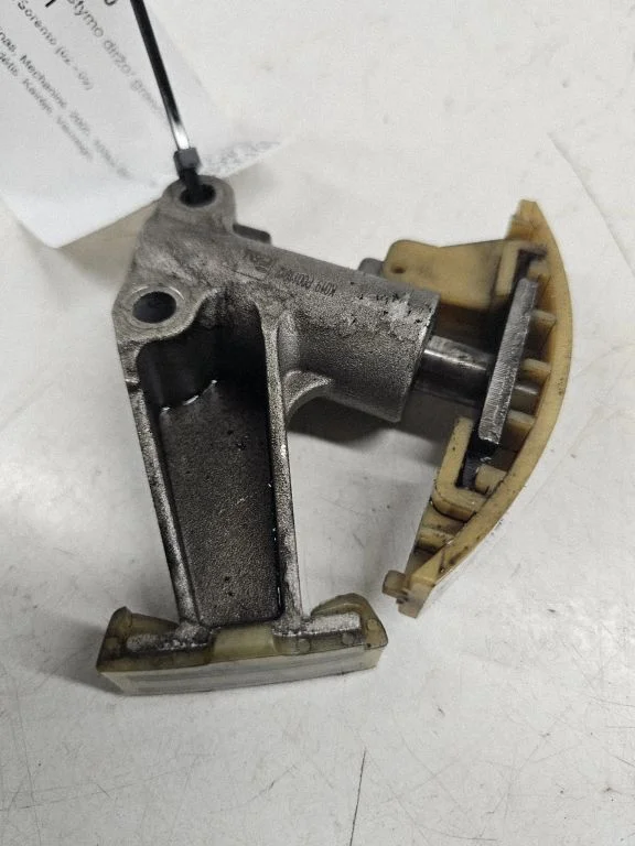 Timing belt/chain tensioner
