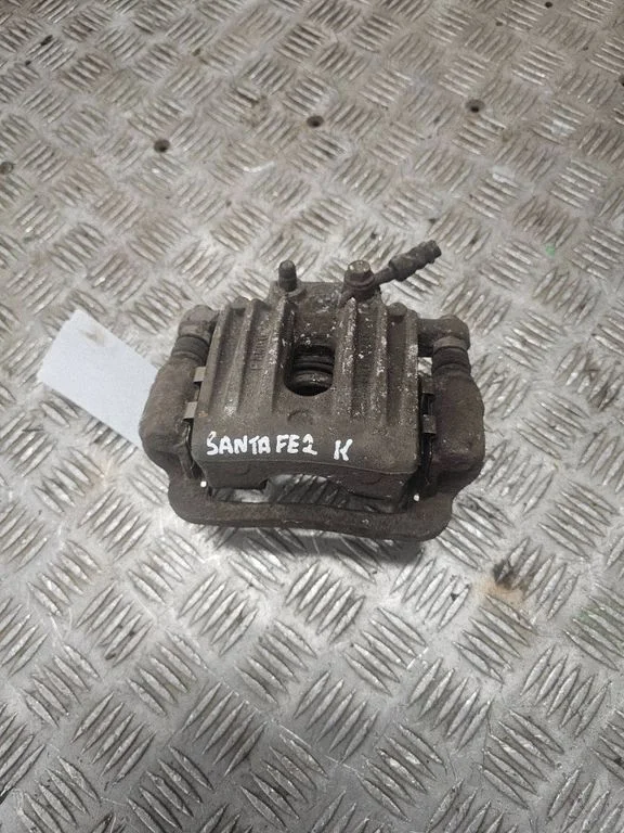 Rear brake caliper – left