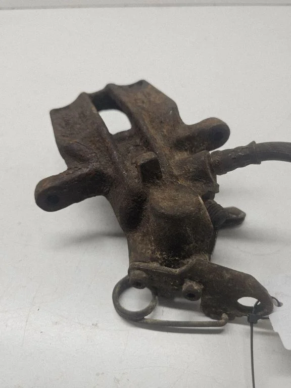 Rear brake caliper – left