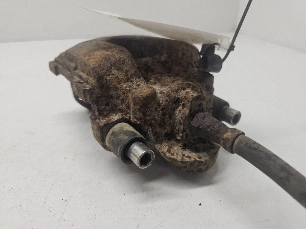 Rear brake caliper – left
