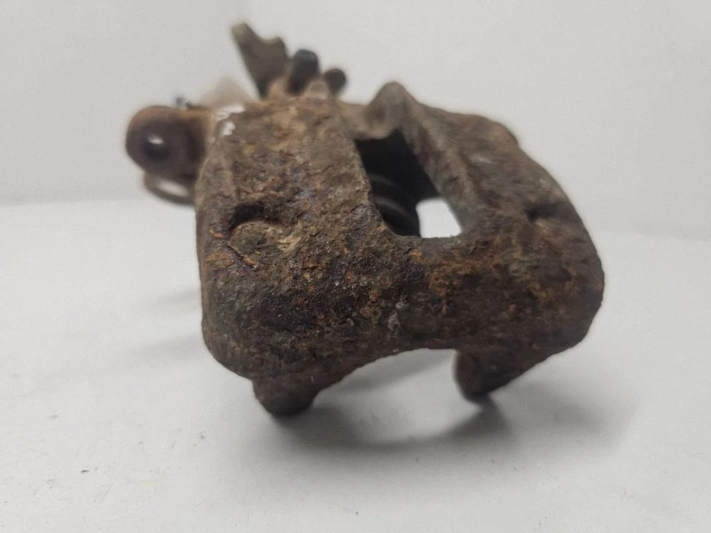 Rear brake caliper – left
