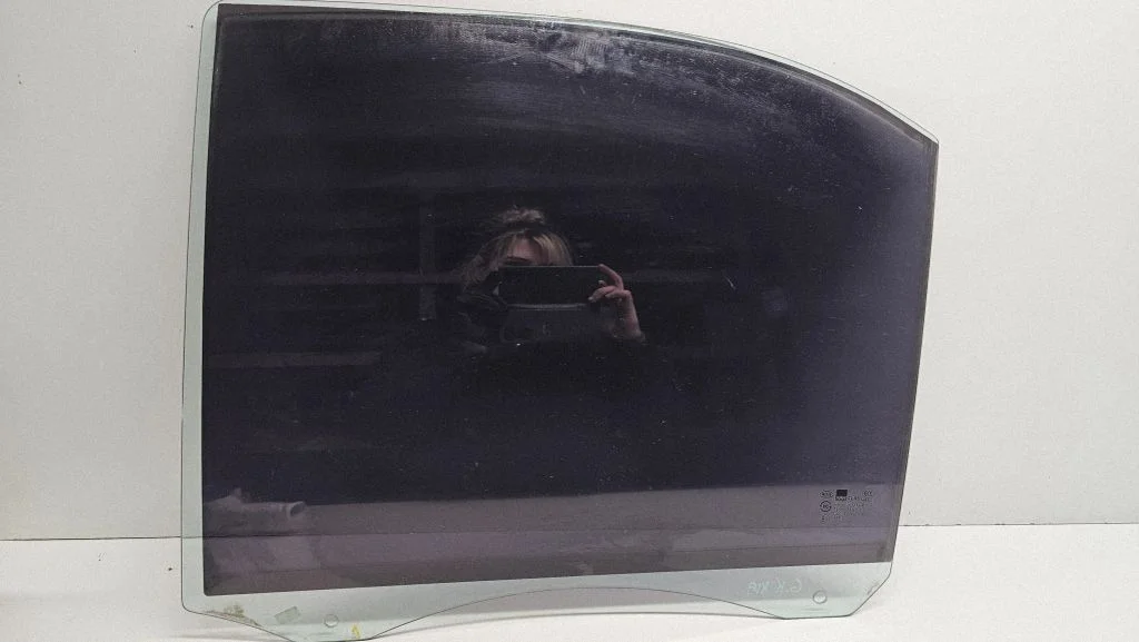 Rear door window glass – left