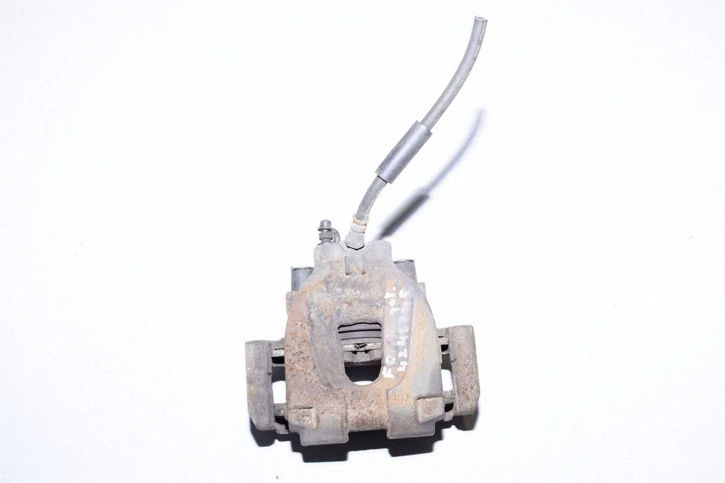 Rear brake caliper – left