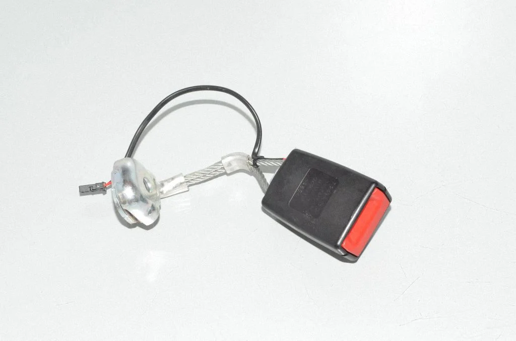 Rear seatbelt buckle – left