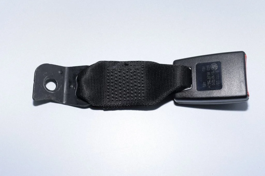 Rear seatbelt buckle – left
