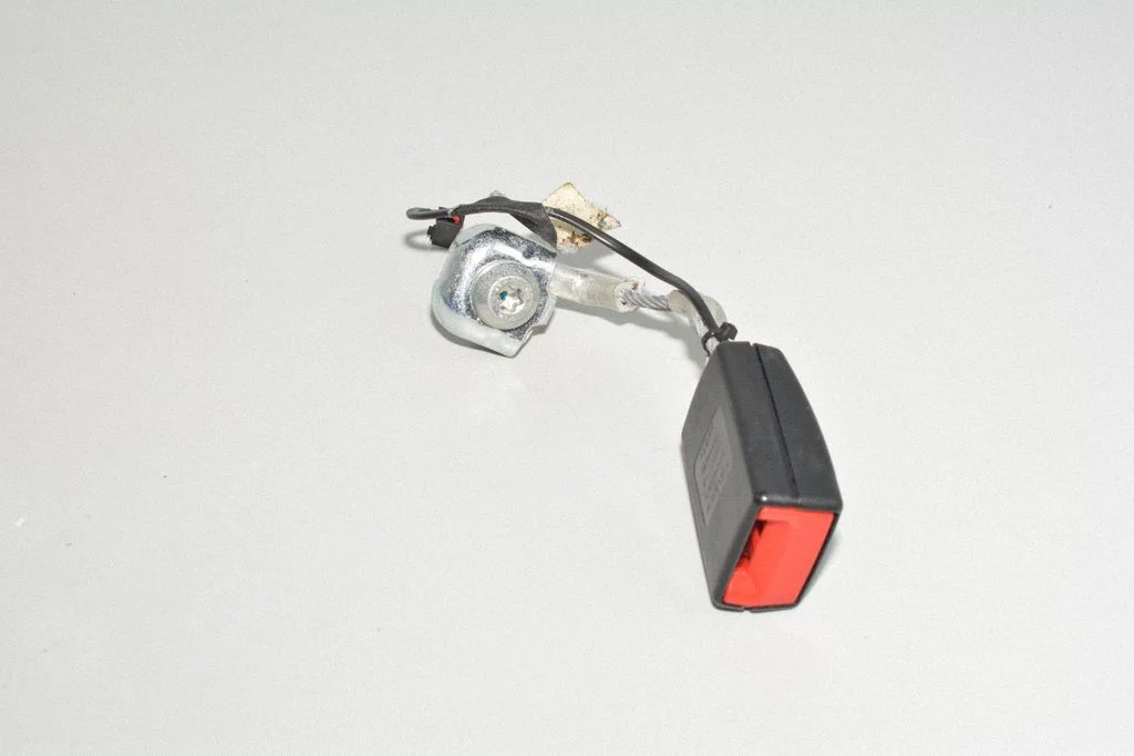 Rear seatbelt buckle – left
