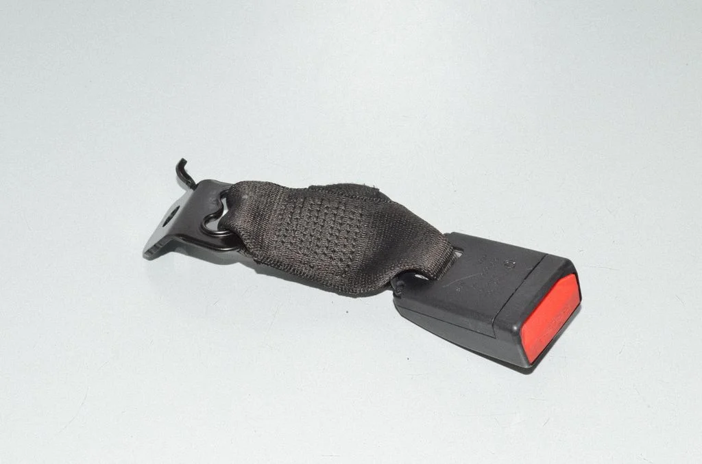 Rear seatbelt buckle – left