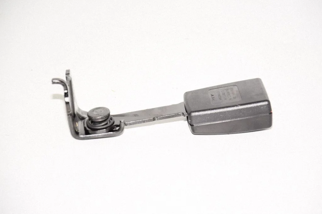 Rear seatbelt buckle – left