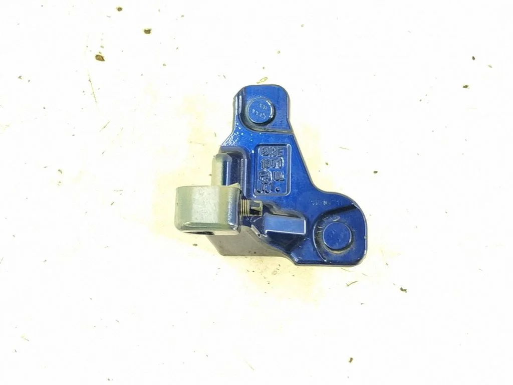 Front door lower hinge – left