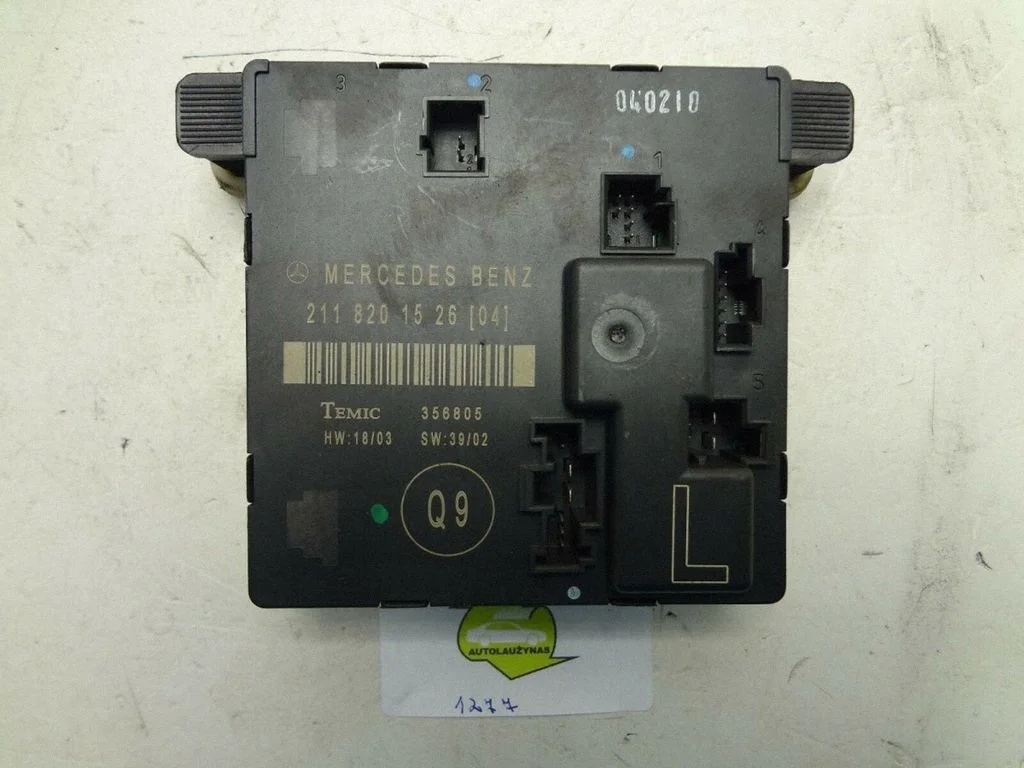 Durvju elektronikas vadības bloks – aizmugurējā kreisā
