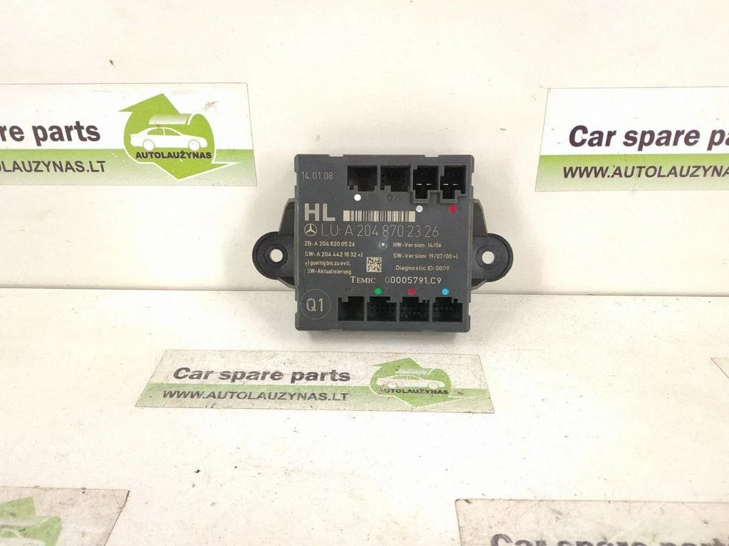 Durvju elektronikas vadības bloks – aizmugurējā kreisā