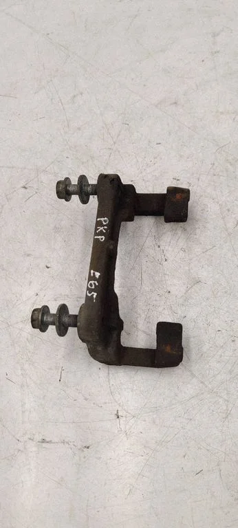 Front Brake Caliper Pad/Carrier – front left