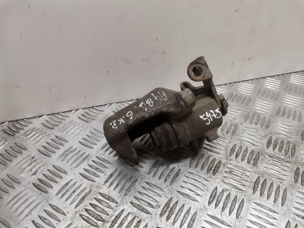 Rear brake caliper – left