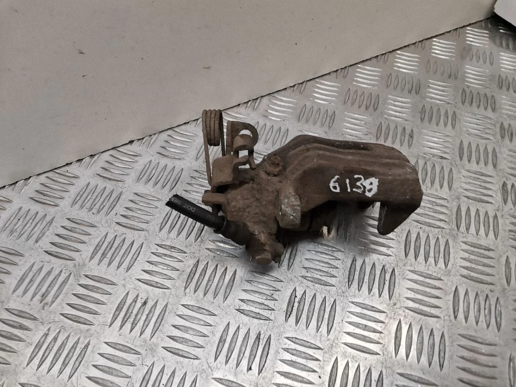 Rear brake caliper – left