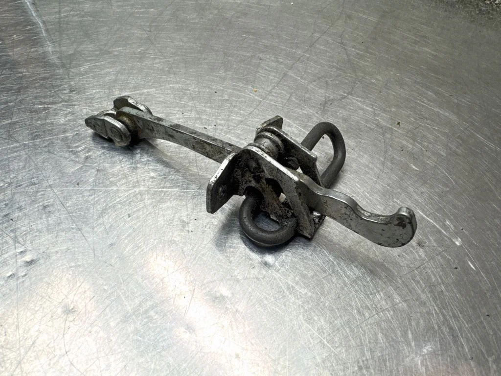 Front door check strap stopper 24434087