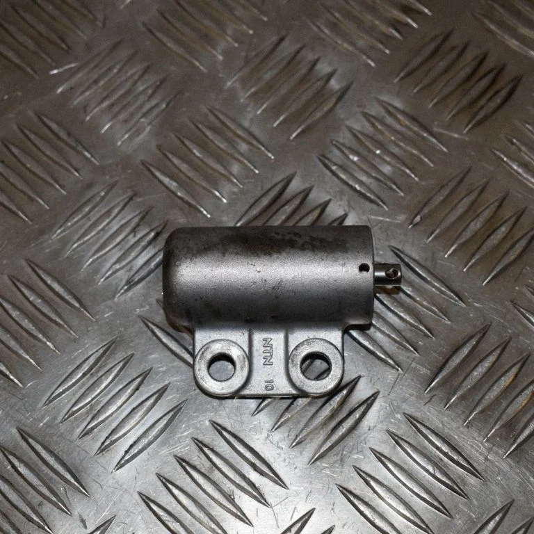 Timing belt tensioner