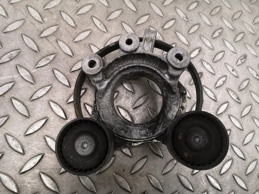 Alternator belt tensioner 7634197