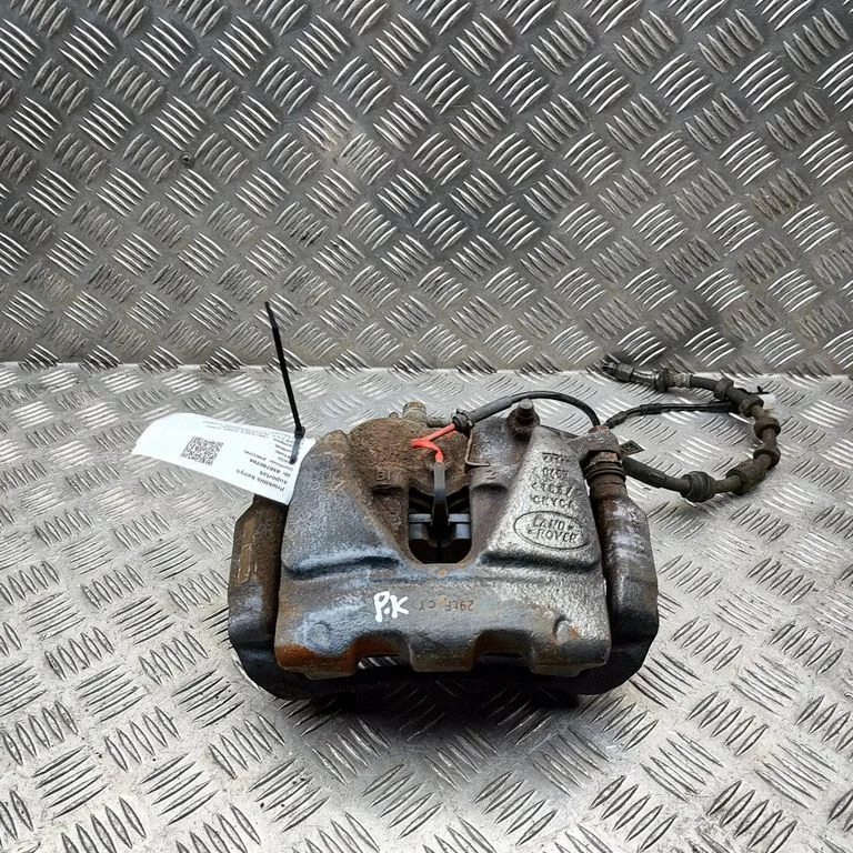 Zacisk hamulcowy przedni HJ322B302AA