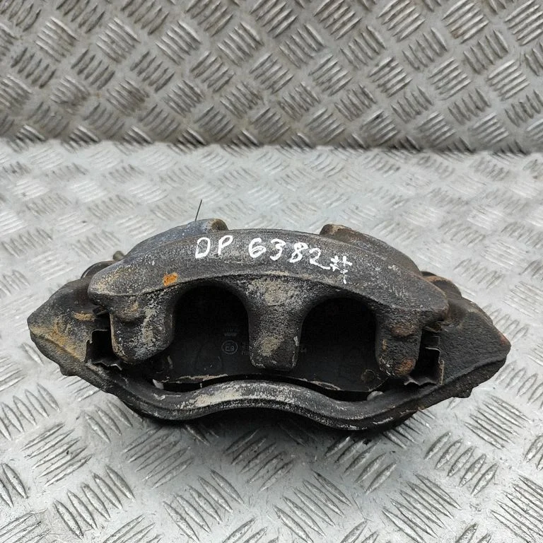 Front brake caliper BK212B134AB