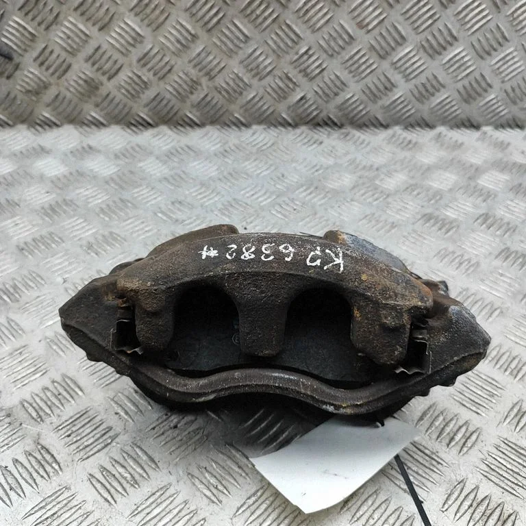 Front brake caliper BK212B302AA