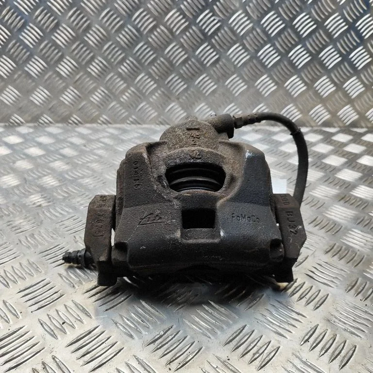 Front brake caliper 6G912B302AC